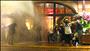 Protestors attacked by water cannon and tear gas take shelter in a nearby hotel (photo: Reuters - Yannis Behrakis)