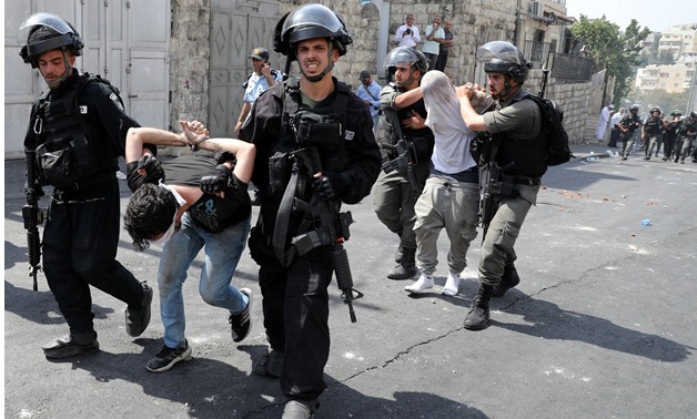 Israeli occupation forces arrest 14 Palestinians in West Bank