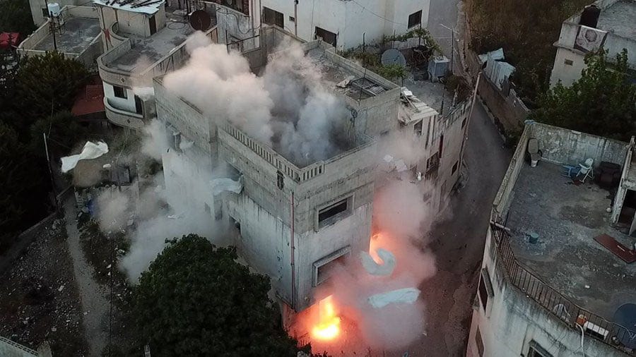 Israeli occupation forces blow up homes of two Palestinian martyrs in Hebron