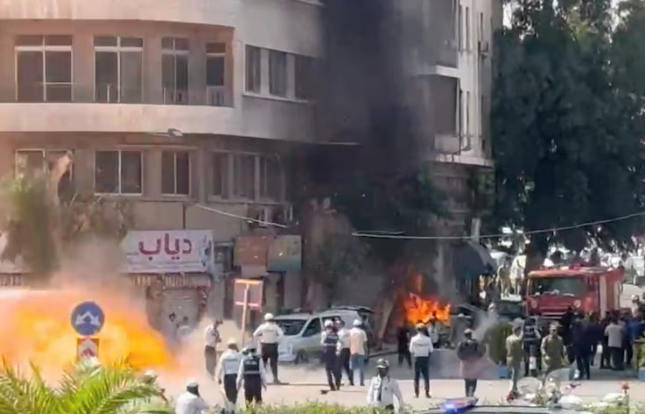 Explosions heard in Damascus during Macron visit, security source says