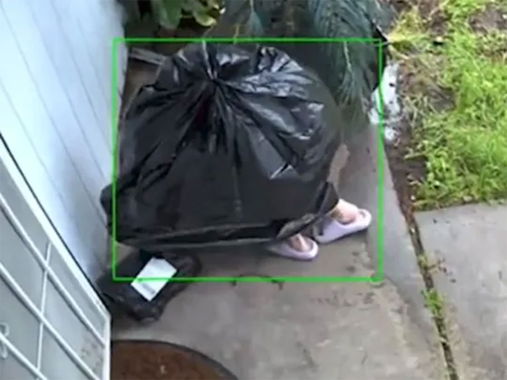 Thief disguises as garbage bag to steal package off porch