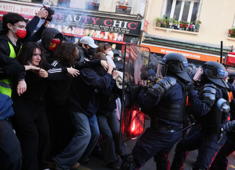 Buildings set ablaze and more than 1,800 arrested as police clash with protesters across France